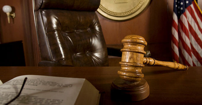 A gavel at a judge's desk